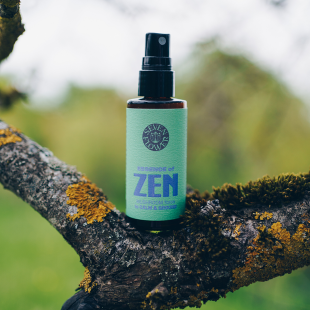 a bottle of 7 Flower Essence of Zen on top of tree branch